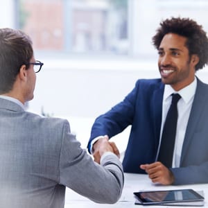International business meeting with foreign buyer signing a trade agreement